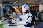 Humans and robots sitting at a workplace