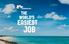 Coast of Aruba with words "The World's Easiest Job"