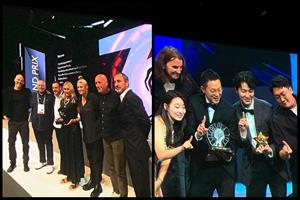 Titanium Grand Prix winners 'The First Digital Nation' from The Monkeys(L) and Glass Lion Grand Prix winners Cheil Worldwide for 'Knock Knock'(R)accept their awards in Cannes on Friday evening.  