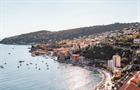 A vertical shot of the city Villefranche-sur-Mer by the sea